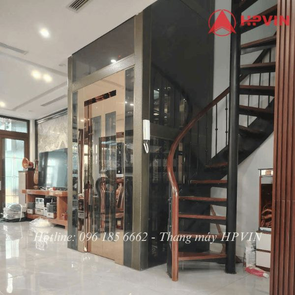 Thang máy kính Thang máy kính cuốn quanh thang bộ